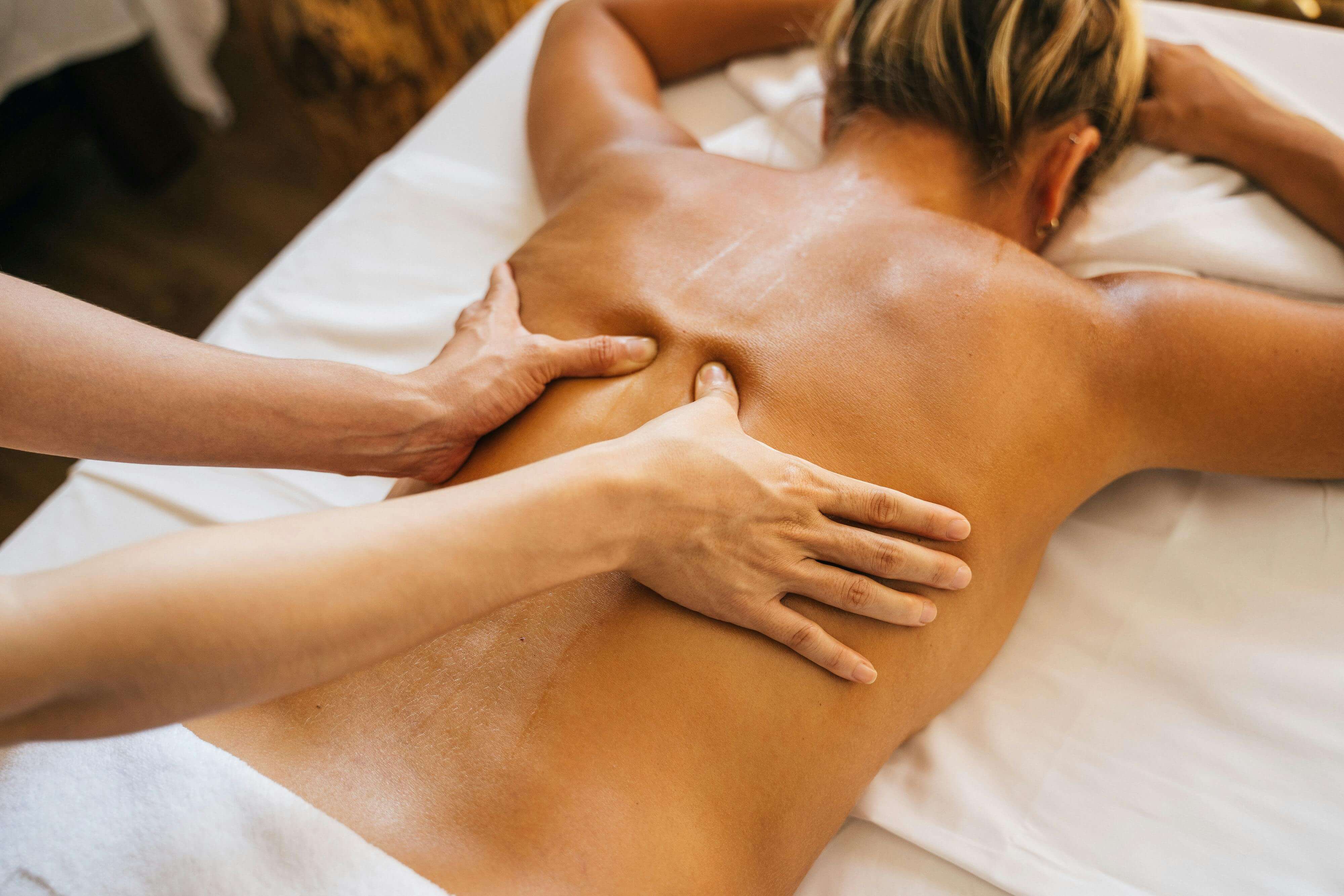 A man massaging a woman’s back