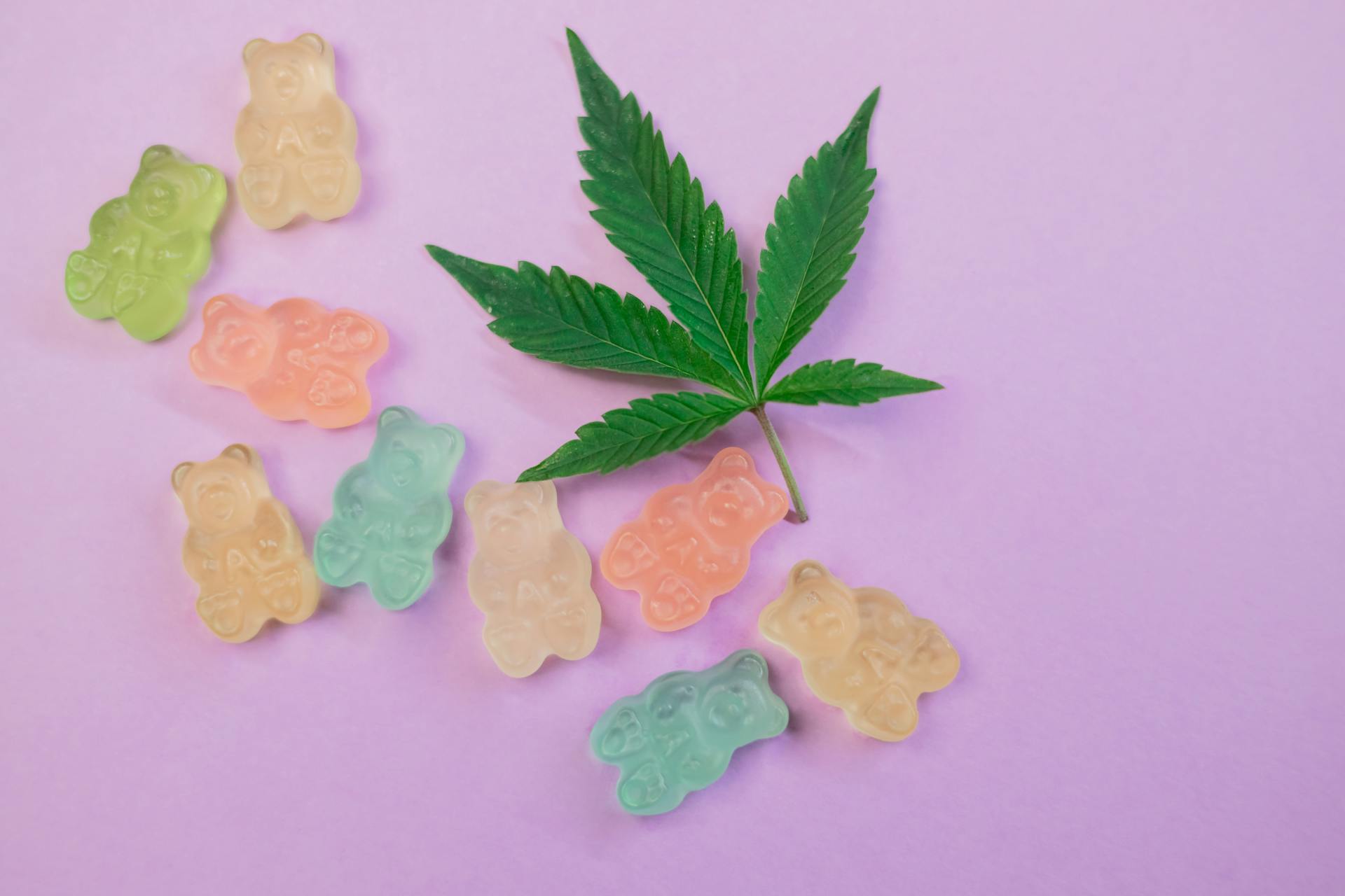 THC gummy bears and a marijuana leaf